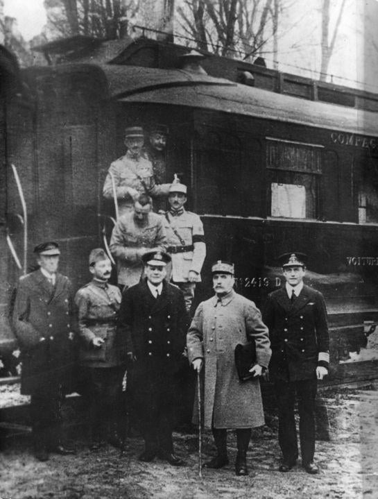 Ferdinand Foch, second from right, pictured outside the carriage in Compiègne after agreeing to the armistice that ended the war there. The carriage was later chosen by Nazi Germany as the symbolic setting of Pétain's June 1940 armistice.