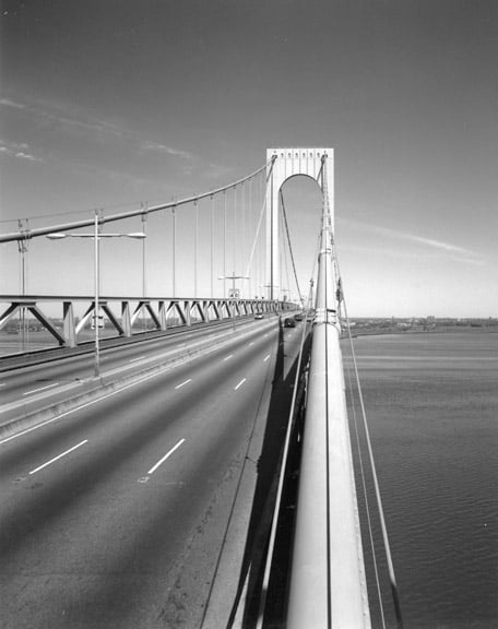 View of the roadway and a tower, showing stiffening trusses