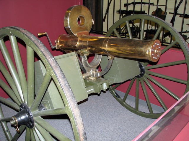 Gatling gun with Accles drum, an odd loading device resembling a pan magazine in that the rotary follower was operated by the gun's action rather than a spring