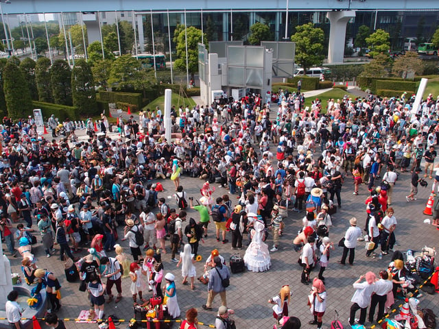A crowd including many cosplayers at Comiket 84 in 2013