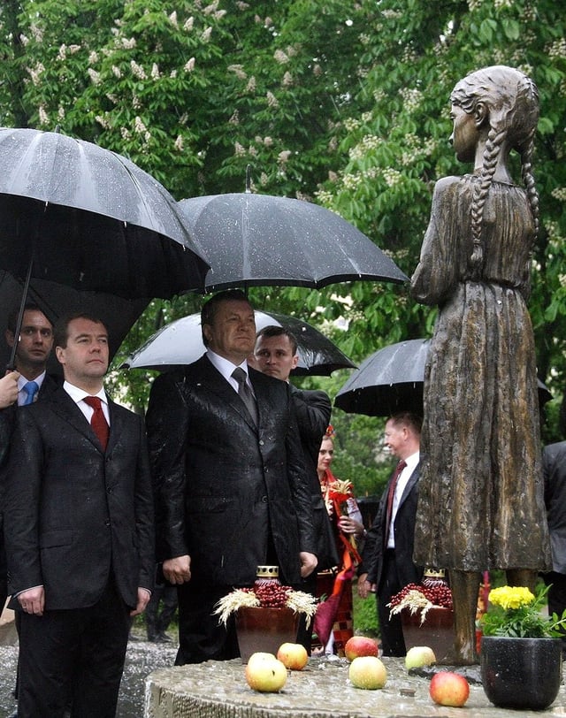 Yanukovych and then Russian President Dmitry Medvedev on 17 May 2010 near Memorial to the Holodomor Victims in Kyiv.