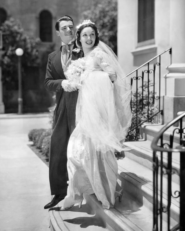 Contract players Wolfe Hopper and Gail Patrick in a July 1936 Paramount Pictures  fashion photograph; 20 years later, William Hopper was Paul Drake and Gail Patrick Jackson was executive producer of the CBS-TV series Perry Mason