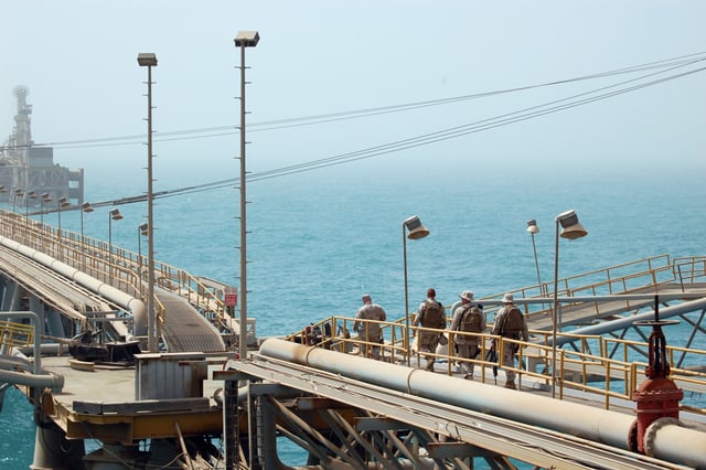 U.S. Navy and Coast Guard personnel stand guard aboard the Al Basrah Oil Terminal in July 2009.