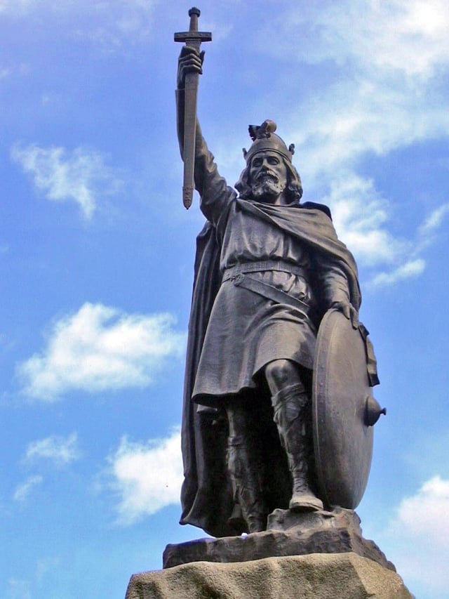 Alfred the Great statue in Winchester, Hampshire. The 9th-century English King proposed that primary education be taught in English, with those wishing to advance to holy orders to continue their studies in Latin.