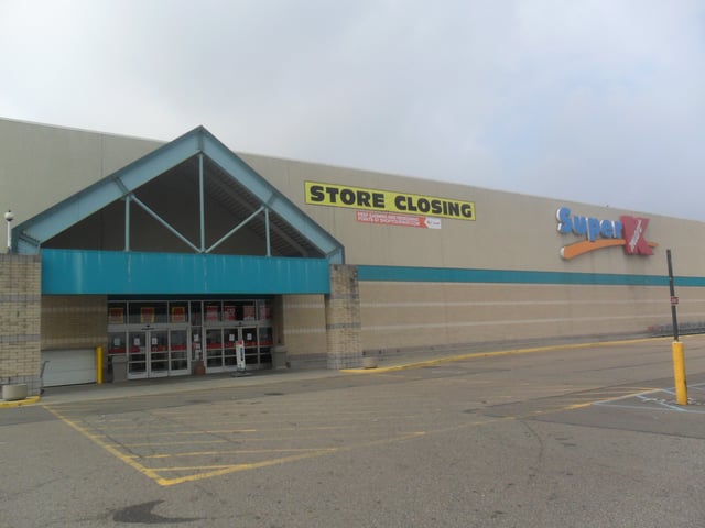 A Super Kmart Center store with Super Kmart signage in Southgate, Michigan in July 2014. As indicated on the banner, this store began a liquidation sale one month earlier and closed on October 12, 2014.