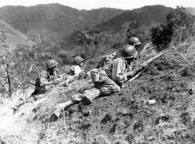 US troops approaching Japanese positions near Baguio, Luzon, 23 March 1945