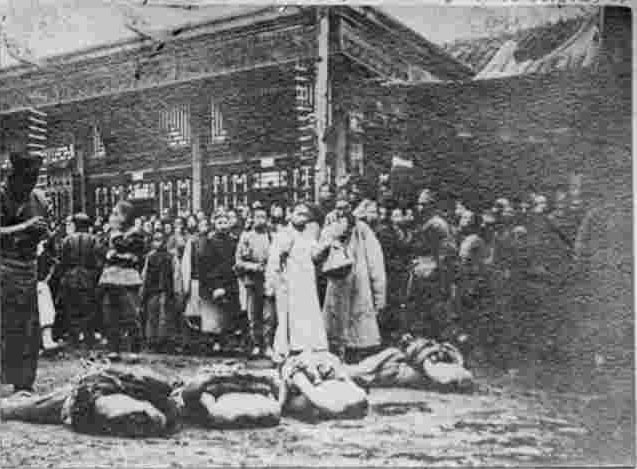 Ranked beheaded bodies on the ground, in Caishikou, Beijing, China, 1905