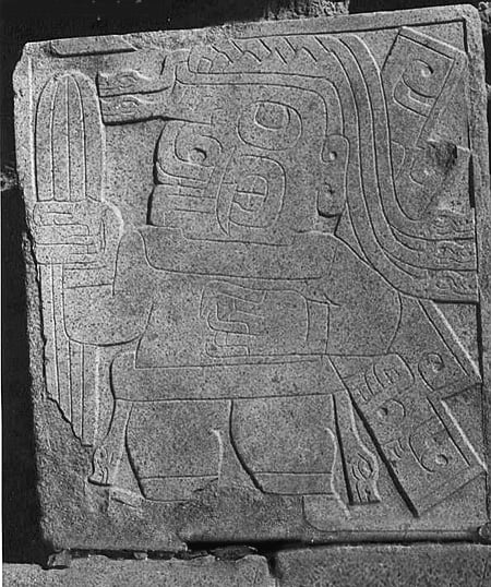 Stone carving from Chavín de Huantar, dated to circa 1000 BC, showing a figure carrying what is thought to be the San Pedro cactus