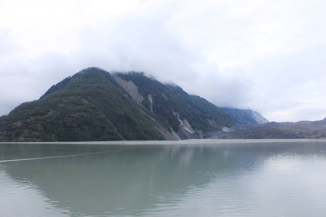 The effect of the tsunami still visible in 2010. Differently-aged vegetation visible on the ridge separating Lituya Glacier from the main part of the bay – looking north from the head of the bay, Lituya Glacier to the right.