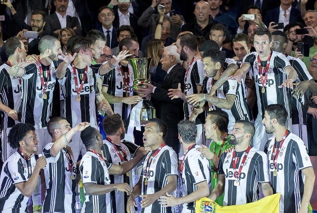 Juventus captain Giorgio Chiellini receives the 2017 Coppa Italia from the President of Italy Sergio Mattarella