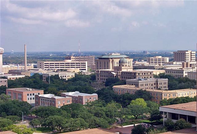 A view of the main campus, looking north from Kyle Field. At the center is the Academic Building with its copper dome.
