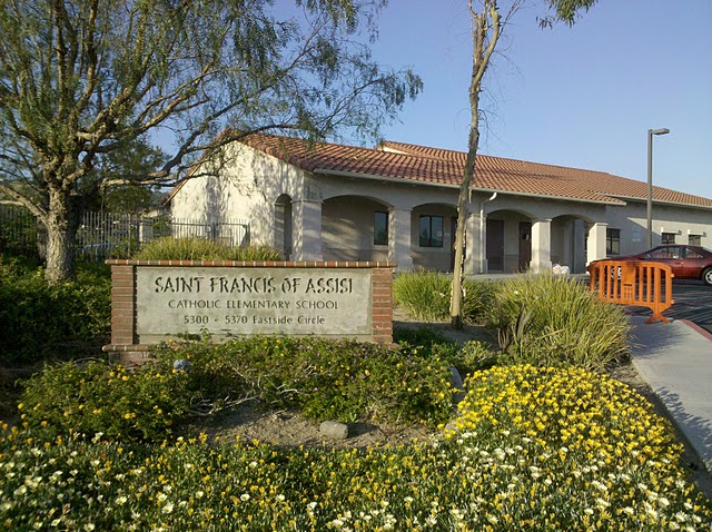 Sign and building as seen from the entrance