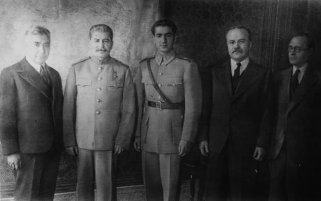 Pahlavi (centre), pictured to the right of Joseph Stalin at the Tehran Conference
