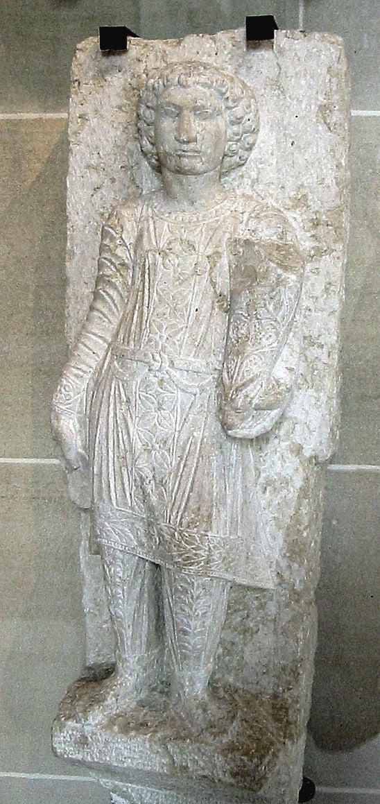 A statue of a young Palmyran in fine Parthian trousers, from a funerary stele at Palmyra, early 3rd century AD