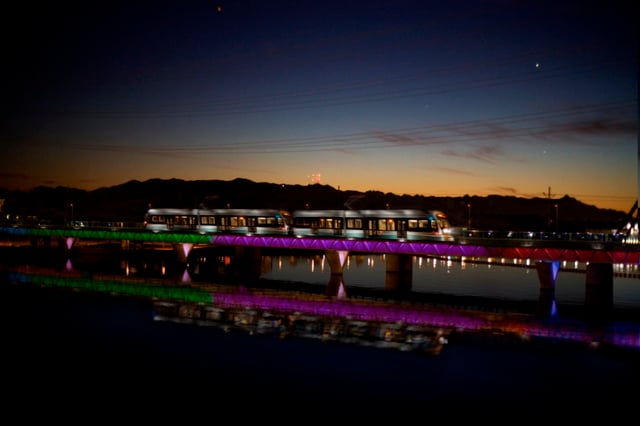 Phoenix light rail over Tempe Town Lake at night