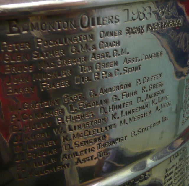 Basil Pocklington, father of Peter, the owner of the Edmonton Oilers, is scratched out in the 1984 engraving.