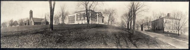 Walnut Hill as it appeared prior to the construction of Tisch Library and steps, circa 1910. In the center is Eaton Hall. The road to the right no longer exists.