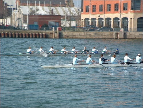 Two crews racing in the annual Lagan Head of the River, Belfast. The closer boat is being overtaken by the boat on the far side.