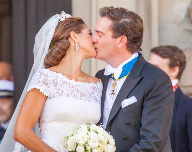 Princess Madeleine of Sweden and Christopher O'Neill kiss each other after their wedding, 2013