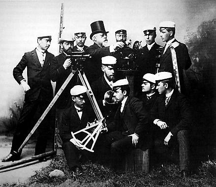 Surveying students with professor in the early days of the university of technology.