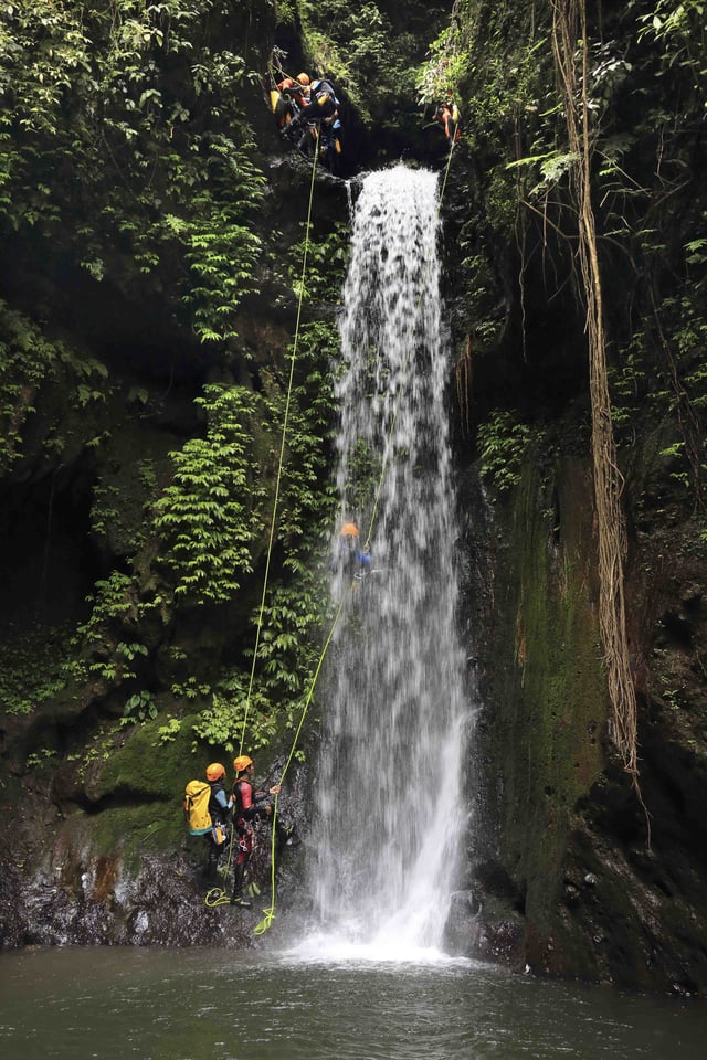 Canyoning in Gitgit Waterfall, Bali, Indonesia