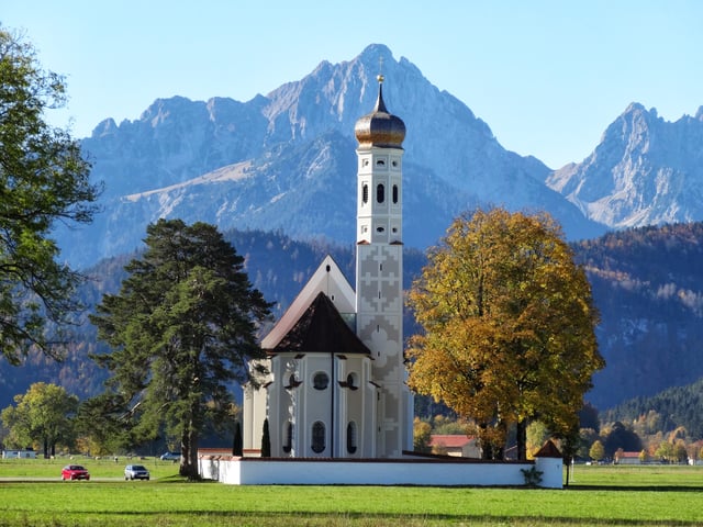 A Catholic church near Füssen with the Alps in the background