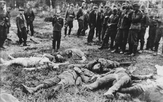 SS killings in Zboriv, 1941. A teenage boy is brought to view his dead family before being shot himself.