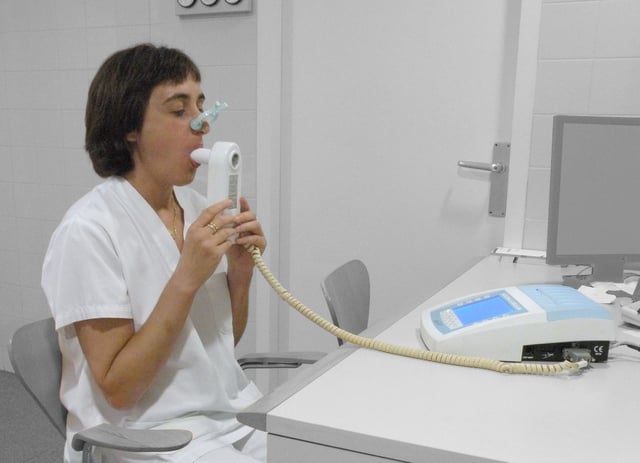 A person doing a spirometry test.