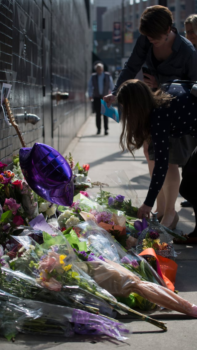 Following his death, fans left flowers, purple balloons, and other mementos beneath Prince's star painted on the front of the First Avenue nightclub.