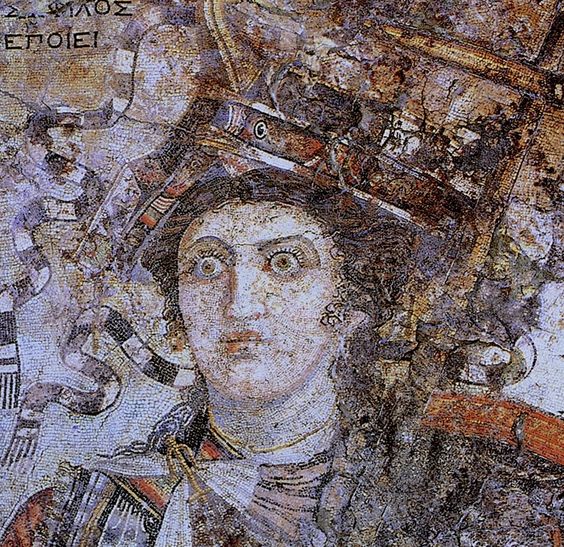 A mosaic from Thmuis (Mendes), Egypt, created by the Hellenistic artist Sophilos (signature) in about 200 BC, now in the Greco-Roman Museum in Alexandria, Egypt; the woman depicted is Queen Berenice II (who ruled jointly with her husband Ptolemy III Euergetes) as the personification of Alexandria, with her crown showing a ship's prow, while she sports an anchor-shaped brooch for her robes, symbols of the Ptolemaic Kingdom's naval prowess and successes in the Mediterranean Sea.