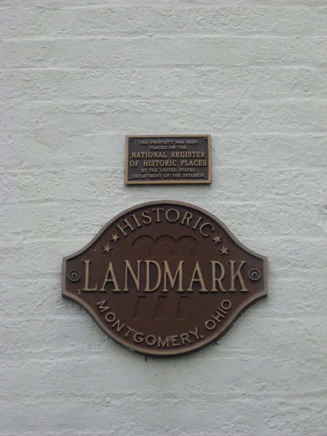 An alternate series of plaques. Buildings on the National Register are often listed in local historic societies as well.