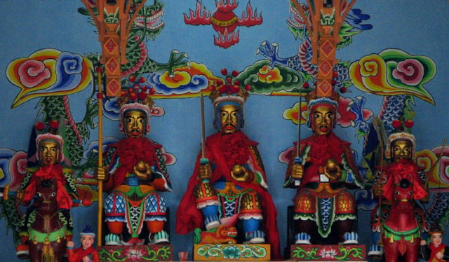 The pan-Chinese Sanxing (Three Star Gods) represented in Bai iconographic style at a Benzhu temple on Jinsuo Island, in Dali, Yunnan.