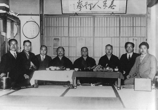 Masters of karate in Tokyo (c. 1930s), from left to right, Kanken Toyama, Hironori Otsuka, Takeshi Shimoda, Gichin Funakoshi, Motobu Chōki, Kenwa Mabuni, Genwa Nakasone, and Shinken Taira