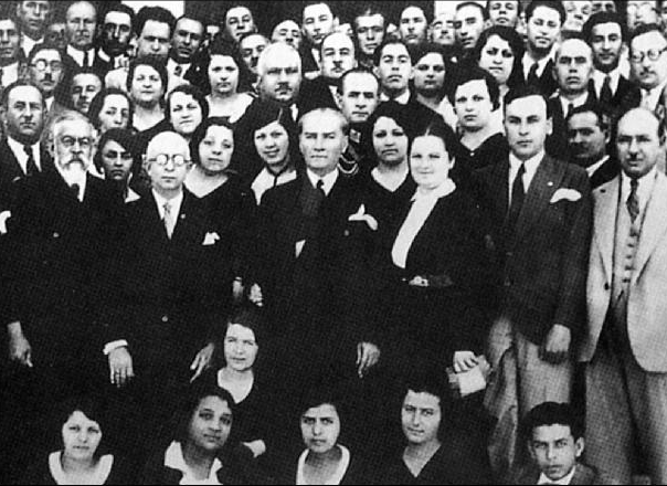 In 1931, during the establishment ceremony of the Turkish History Institution. Atatürk is standing in the middle with Munis Tekinalp and Yusuf Akçura on the left.