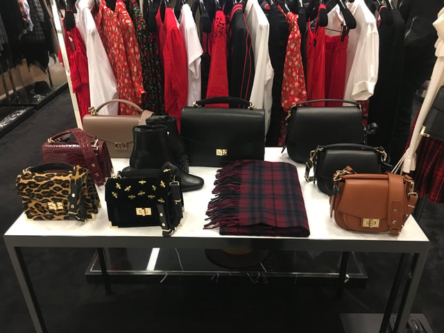 Bags designed by Ratajkowski for The Kooples on display at Bloomingdale's at 900 North Michigan