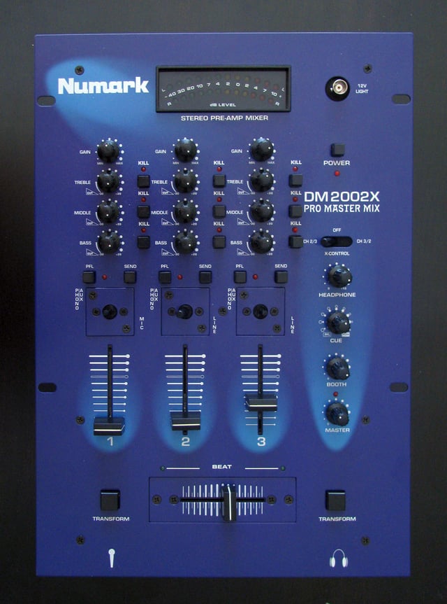 A Numark DM2002X Pro Master DJ mixer. This three channel mixer can have up to three input sound sources. The gain control knobs and equalization control knobs allow the volume and tone of each sound source to be adjusted. The vertical faders allow for further adjustment of the volume of each sound source. The horizontally-mounted crossfader enables the DJ to smoothly transition from a song on one sound source to a song from a different sound source.