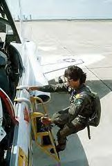 Then Lieutenant Custodio climbing down from the cockpit of a T-38
