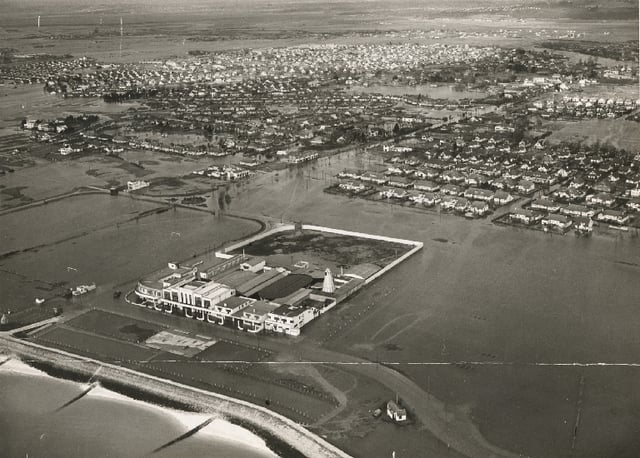 The flooded Canvey Island sea front, amusements and residential areas in 1953