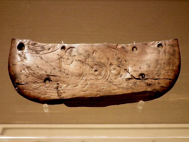 Butterfly-shaped ivory vessel with the pattern of two birds facing the sun, Hemudu culture (5500–3300 BC)