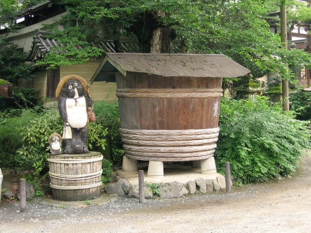 Tanuki next to a shrine