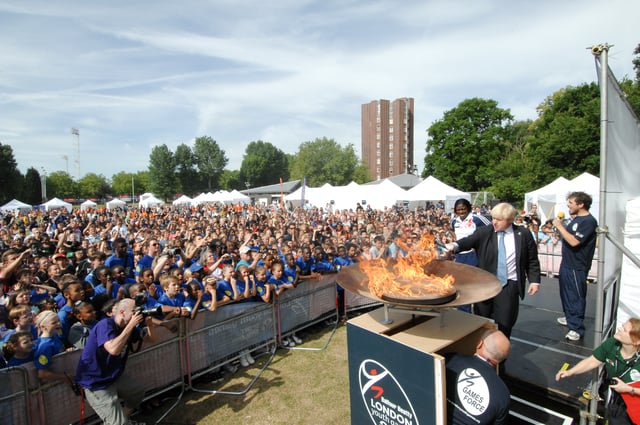 Johnson lights the flame at the 2010 London Youth Games opening ceremony