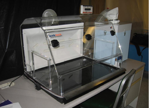 A nanomaterial containment hood, an example of an engineering control used to protect workers handling them on a regular basis.