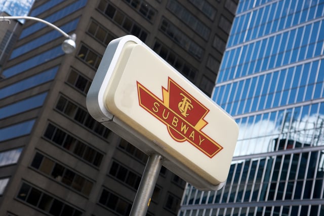A subway entrance sign in Downtown Toronto, iconic until 2002 when the logo was abandoned for the original TTC logo