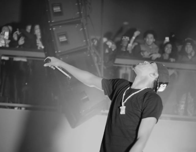 Cole performing during the What Dreams May Come Tour