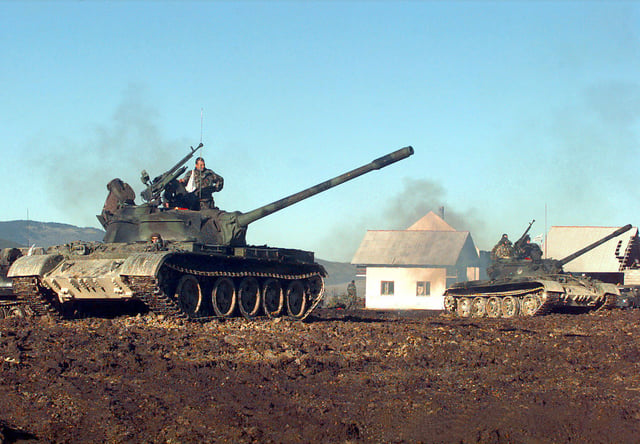 Two Croatian Defense Council (HVO) T-55 Main Battle Tanks pull into firing position during a three-day exercise held at the Barbara Range in Glamoč, Bosnia and Herzegovina.