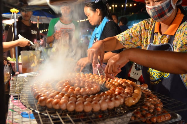 Sai krok Isan being freshly grilled at a market in Uttaradit, Thailand