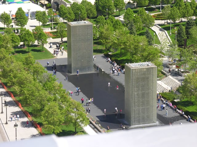 Opposing 50-foot (15 m) towers represent Plensa's dualism theme.