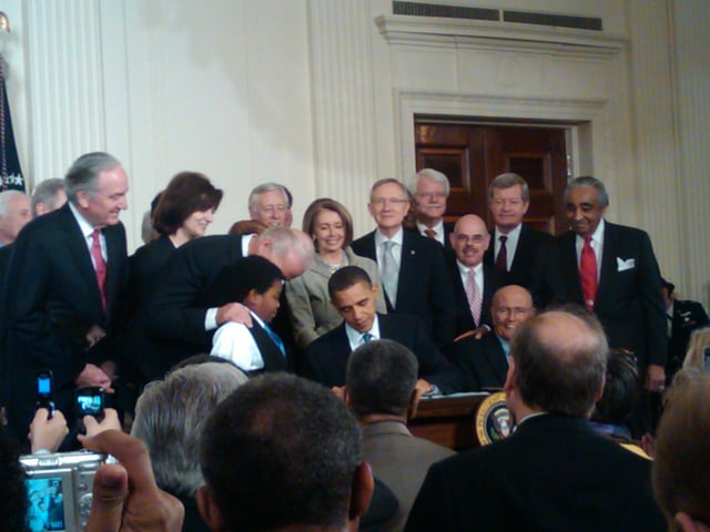 President Barack Obama signing the Patient Protection and Affordable Care Act into law at the White House on March 23, 2010