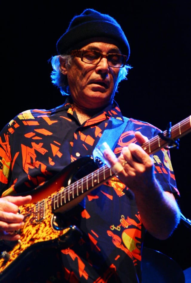 Ry Cooder plays slide-guitar with open tunings.