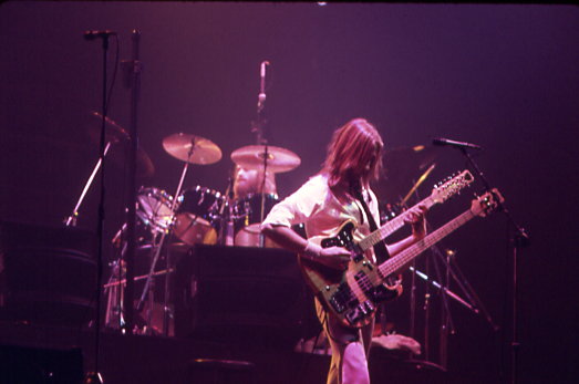 Genesis bandmate Mike Rutherford on bass with Collins on drums, performing in Toronto, 3 June 1977